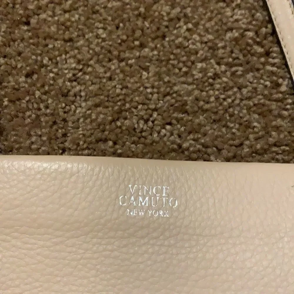 Vince Camuto soft pink crossbody wristlet.